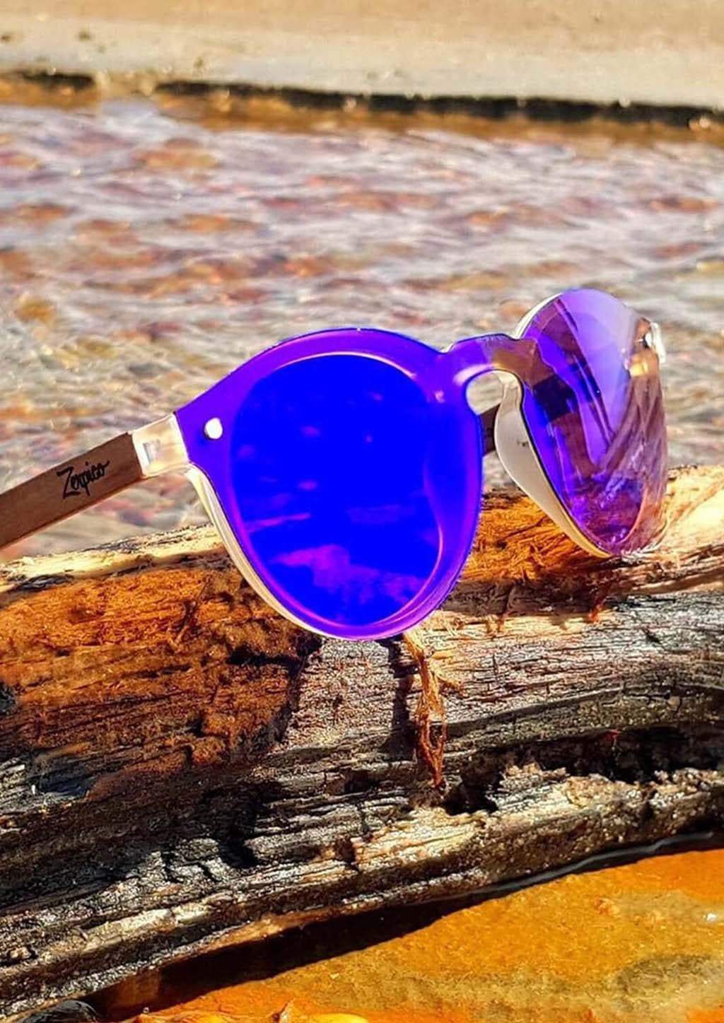 Eyewood Tomorrow - Lyra wooden sunglasses featuring purple polarized lenses and rosewood frame, displayed in an elegant empress tree case.