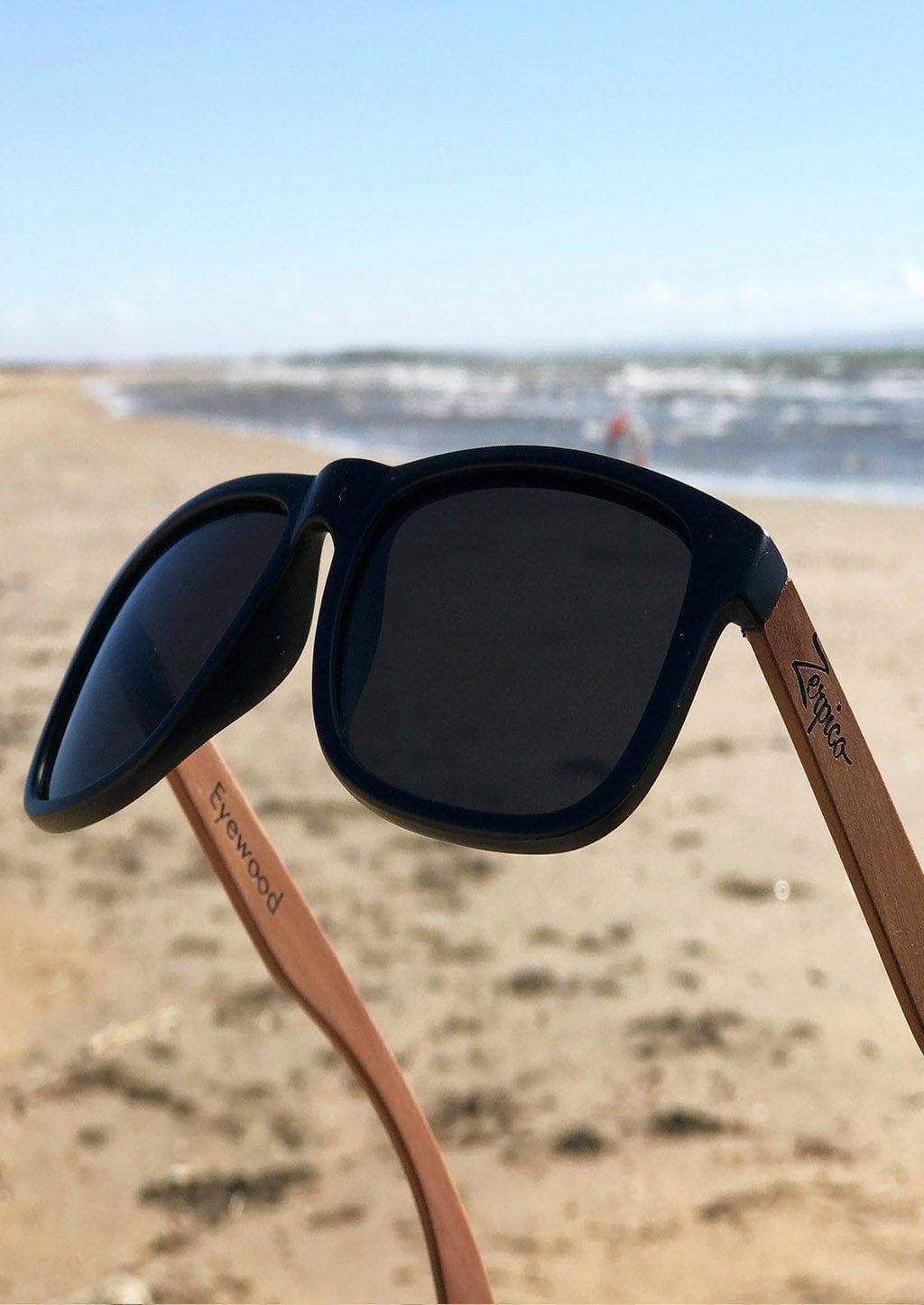 Eyewood Wayfarer sunglasses in Pitch Black with polarized lenses and rosewood frame, displayed in an elegant empress tree case.