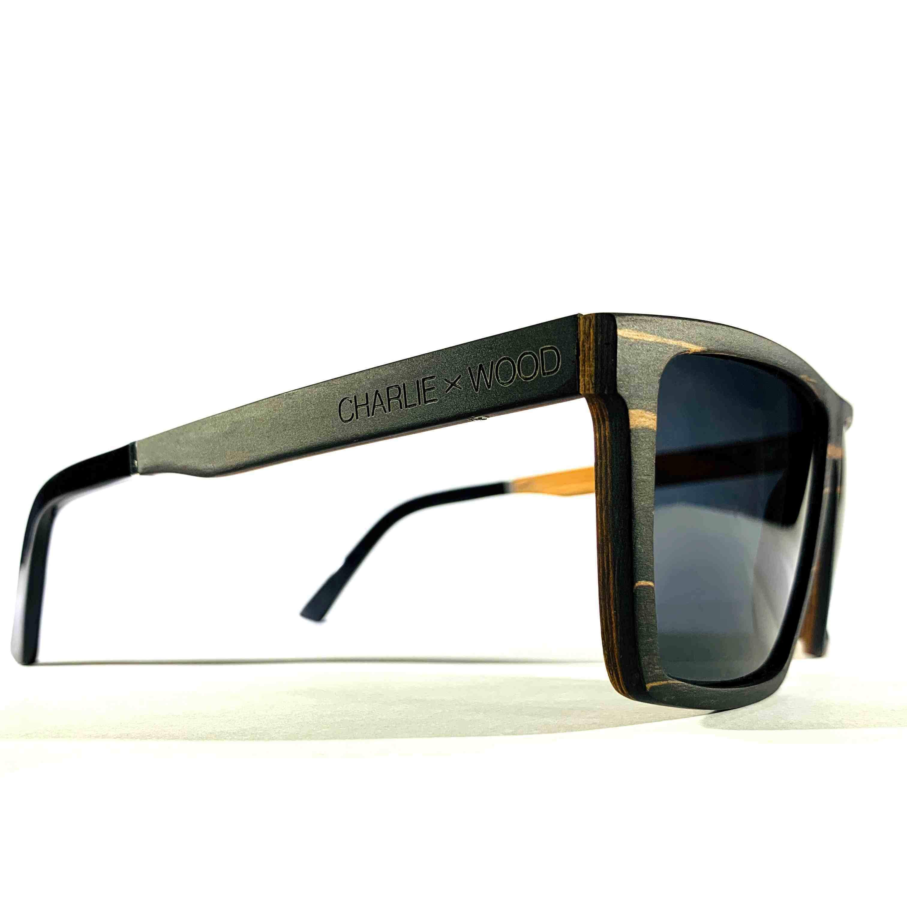 Kirkwood sunglasses featuring a stylish ebony wood frame and polarized grey lenses, perfect for outdoor activities.