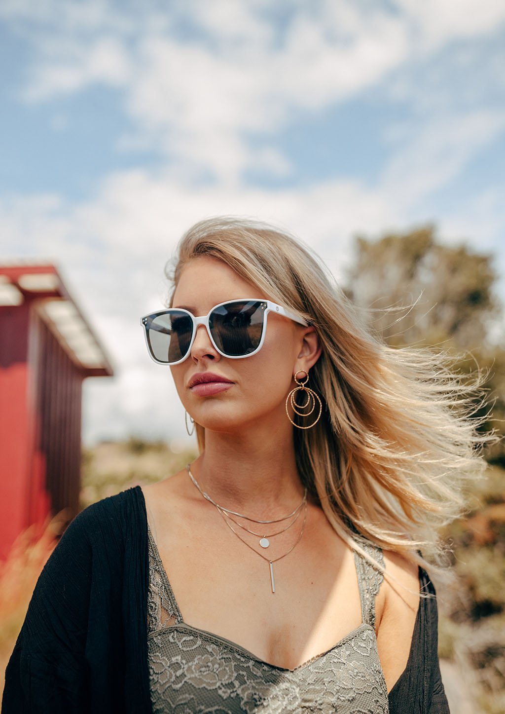 Lotus sunglasses from the Babylon Series featuring a classic wayfarer shape and vibrant colors, showcasing high-quality plastic and aluminium hinges.