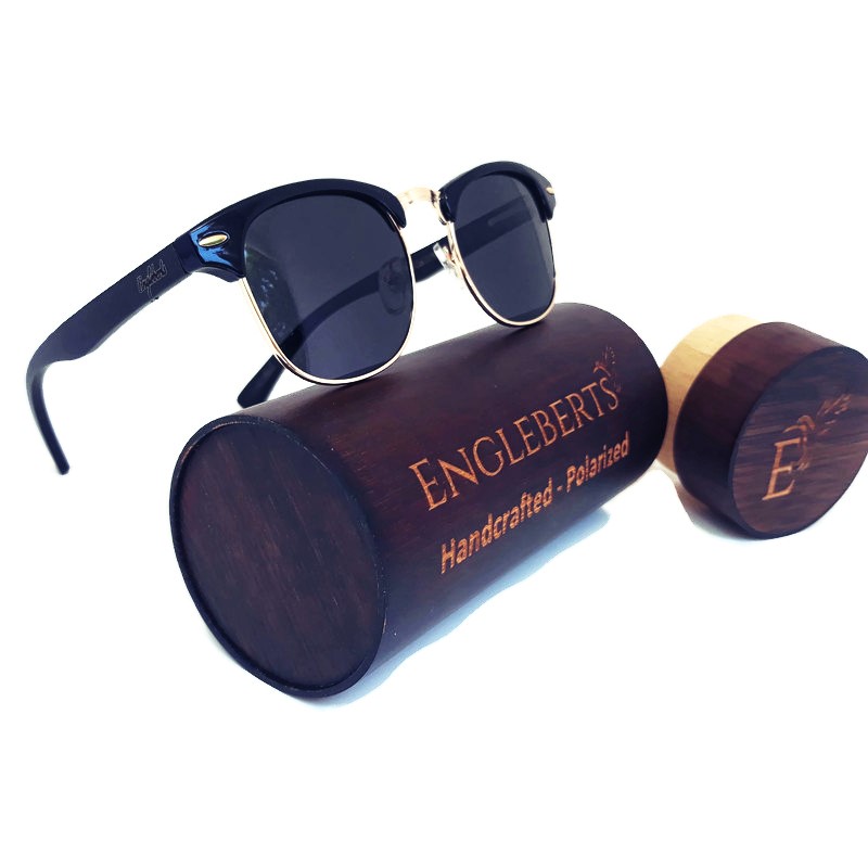 Midnight Black Bamboo Club Sunglasses displayed with a bamboo case, showcasing their handcrafted design and polarized lenses.