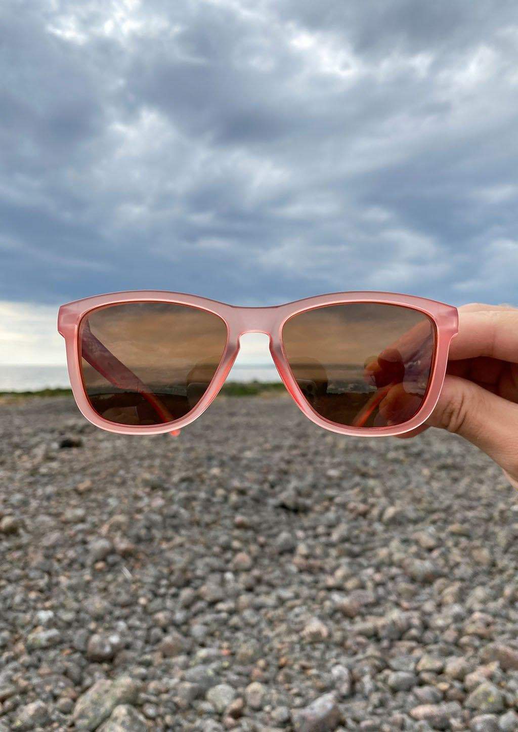 MOOD Wayfarer V2 Cherry sunglasses featuring a red frame and red polarized lenses, stylishly designed for outdoor adventures.