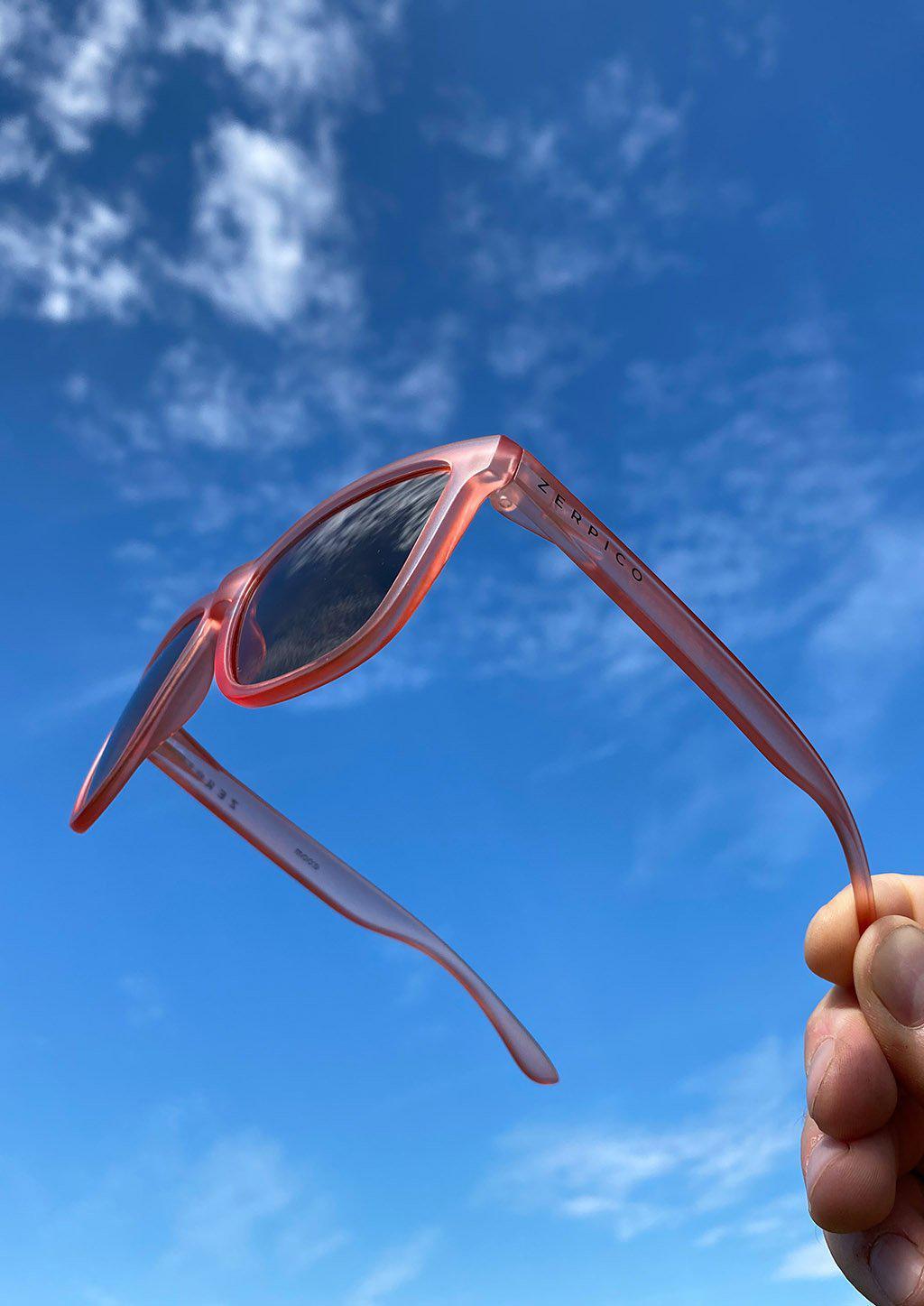 MOOD Wayfarer V2 - Orchid sunglasses featuring a pink frame and black polarized lenses, perfect for stylish sun protection.