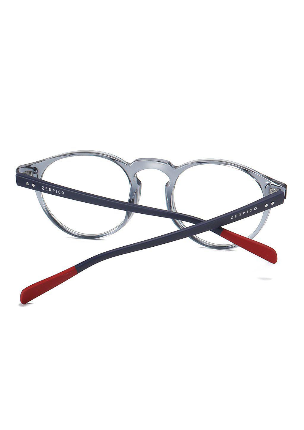 Nexus Holo blue-light glasses featuring a round design with flexible rubber arms, available in multiple colors.