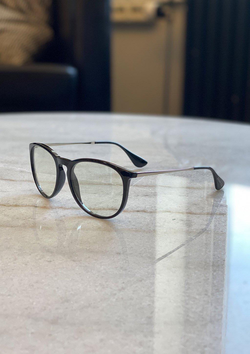 Nano anti blue-light glasses featuring a stylish cat-eye design, available in black, tortoise, and clear colors.