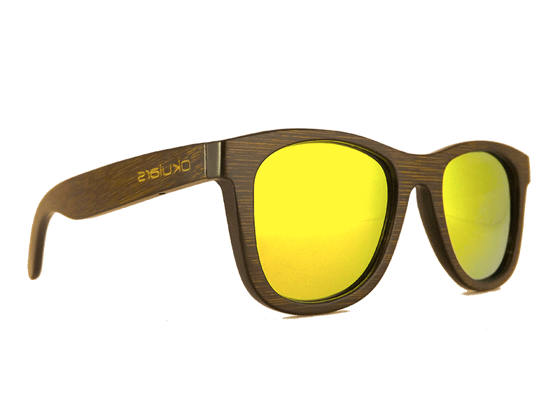 Okulars® Dark Bamboo sunglasses featuring a dark bamboo frame and golden polarized lenses, elegantly displayed in a natural setting.