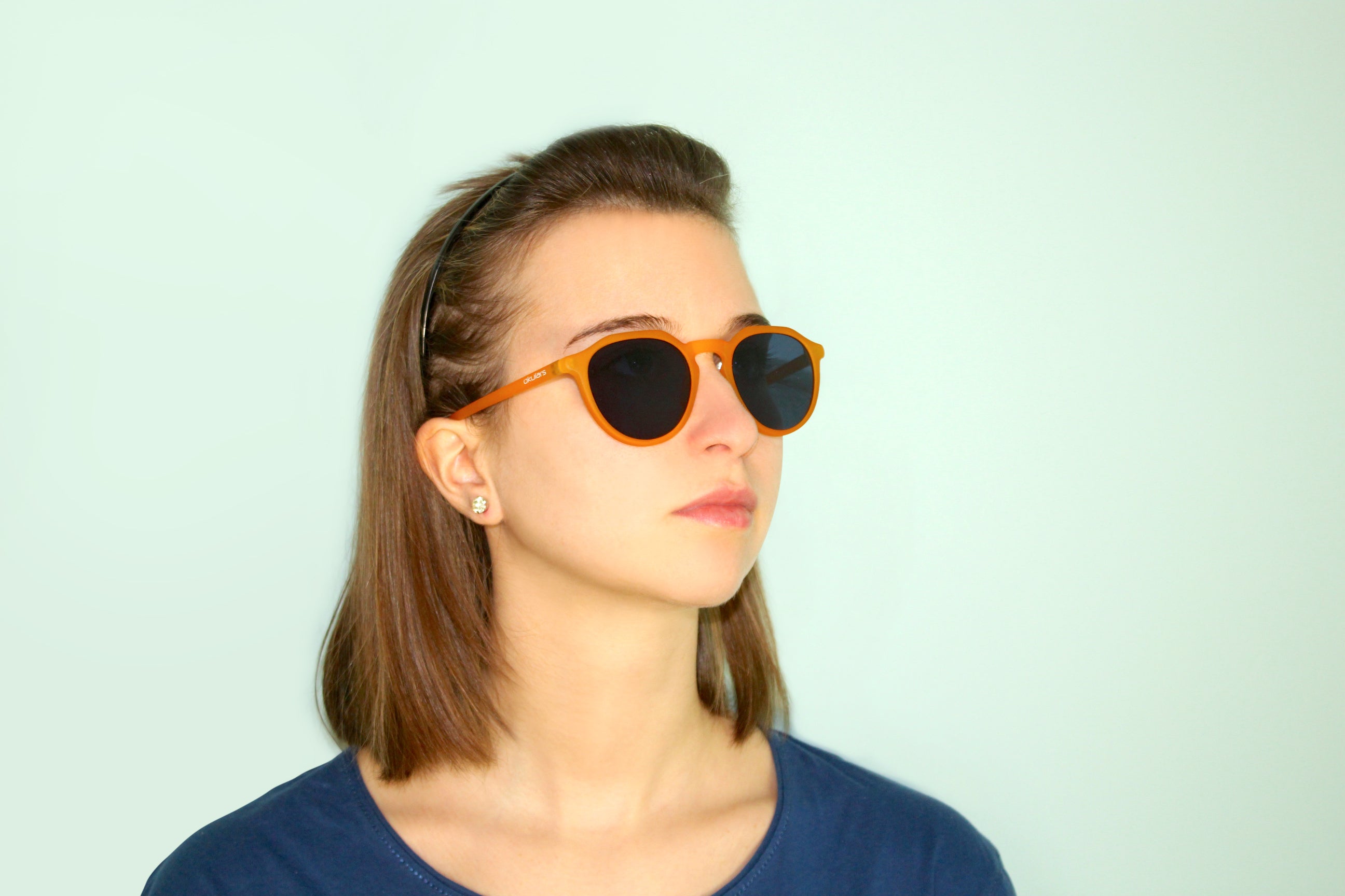 Okulars Eco Pacific Amber Black sunglasses with a matte finish, showcasing a stylish design made from recycled materials.