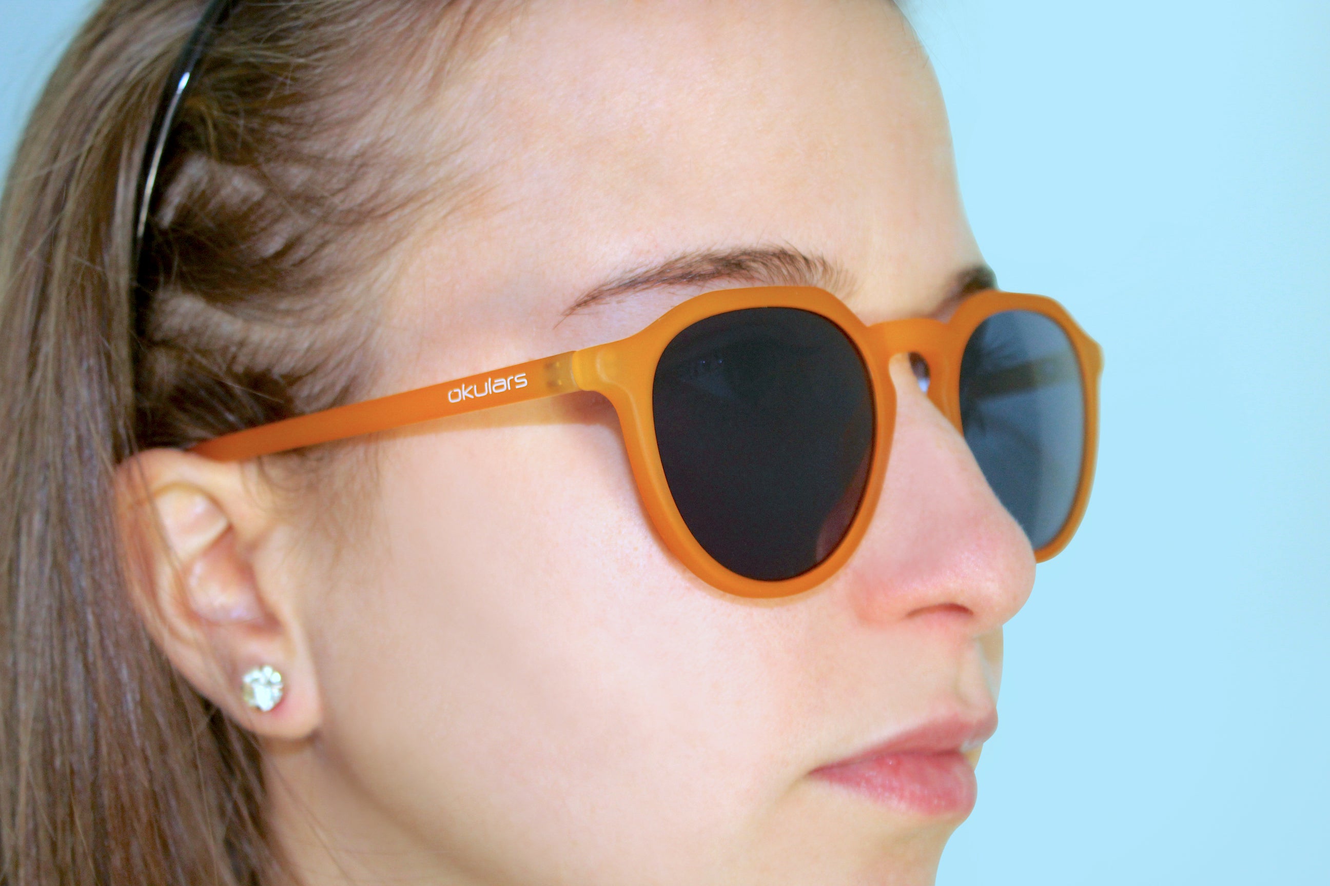 Okulars Eco Pacific Amber Blue sunglasses made from recycled materials, featuring a matte finish and UV400 lenses.