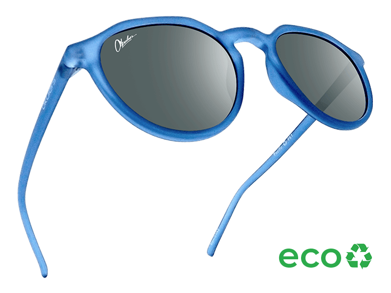 Okulars Eco Pacific Ocean Black sunglasses with a sleek black design, made from 100% recycled materials, displayed on a soft surface.