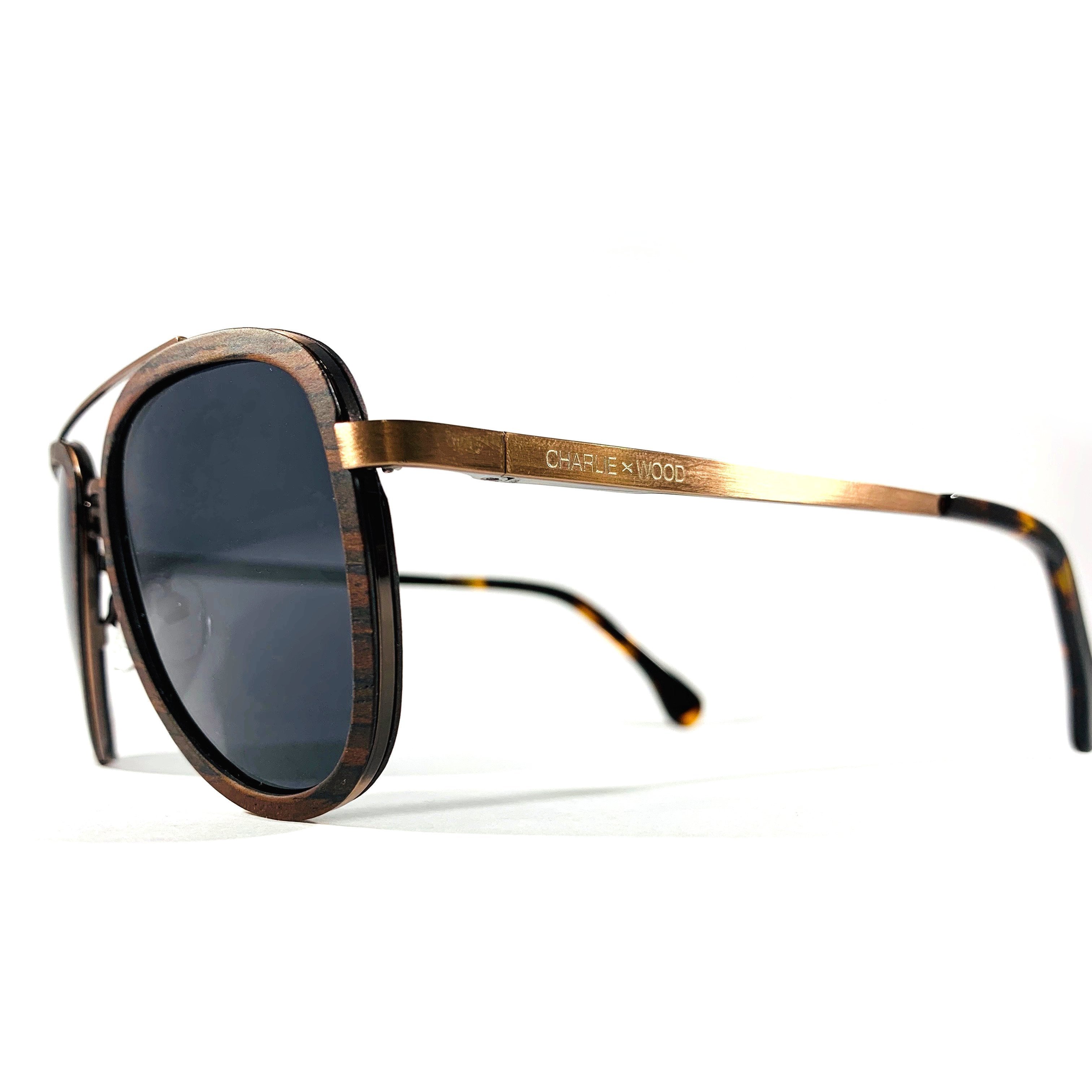 Old 4th Ward sunglasses made from ebony wood with polarized grey lenses, showcasing a stylish and durable design.