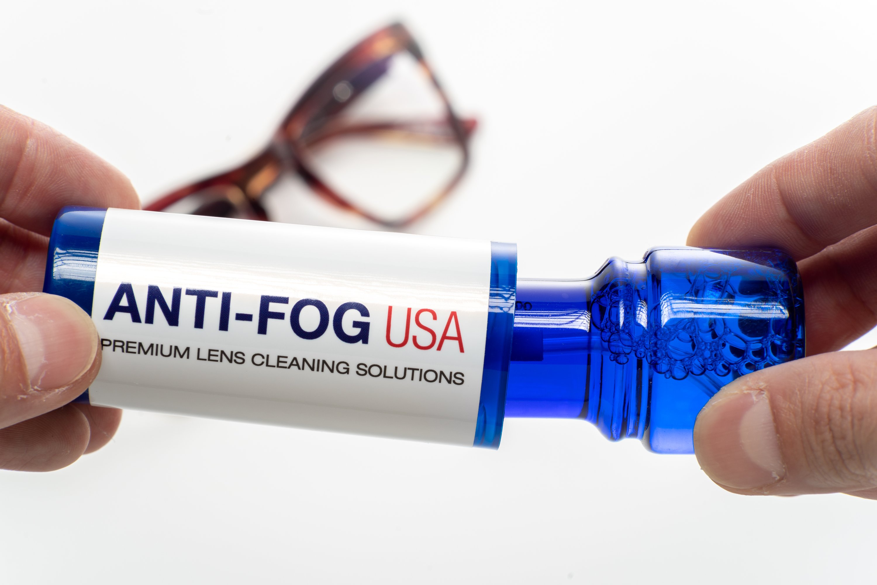 Premium Lens Cleaner with microfiber cloth and carrying case, designed for safe and effective lens cleaning.