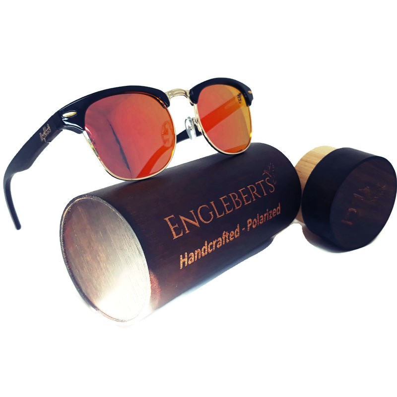 Sunset Polarized Sunglasses made of black bamboo, displayed with a wooden case, showcasing their stylish design and eco-friendly materials.