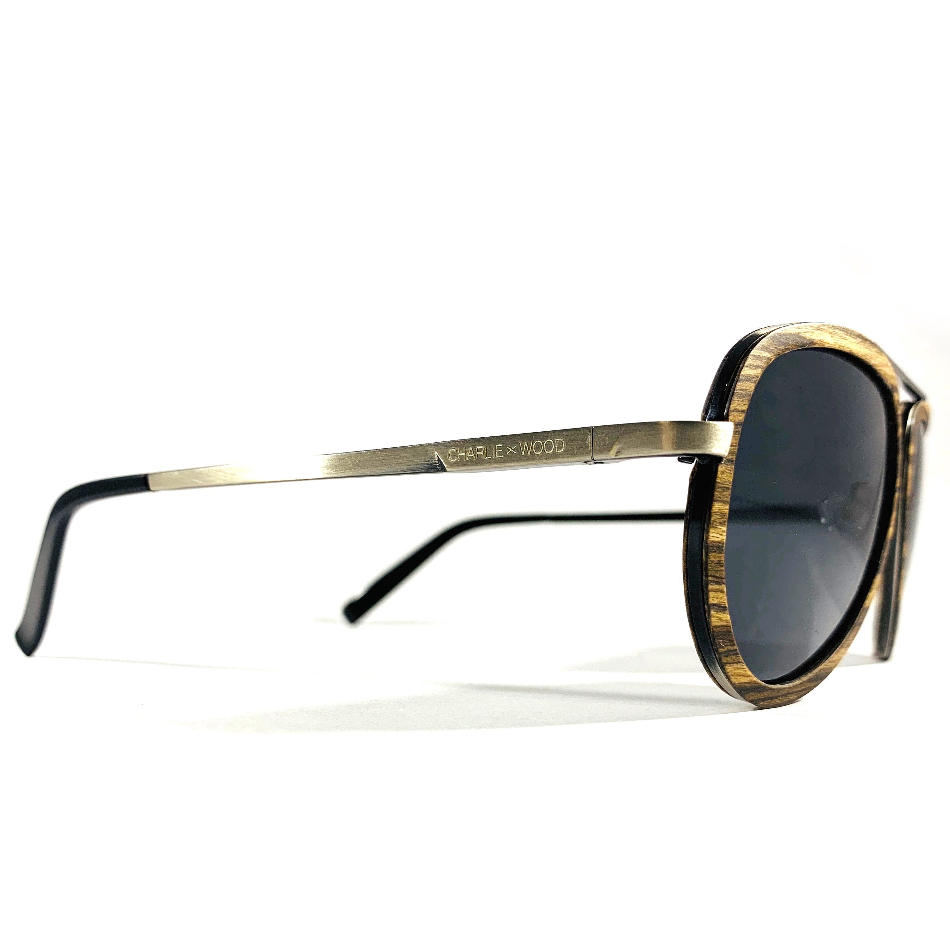 Sweet Auburn sunglasses featuring a brown oak wood frame and grey polarized lenses, stylishly designed for adults.