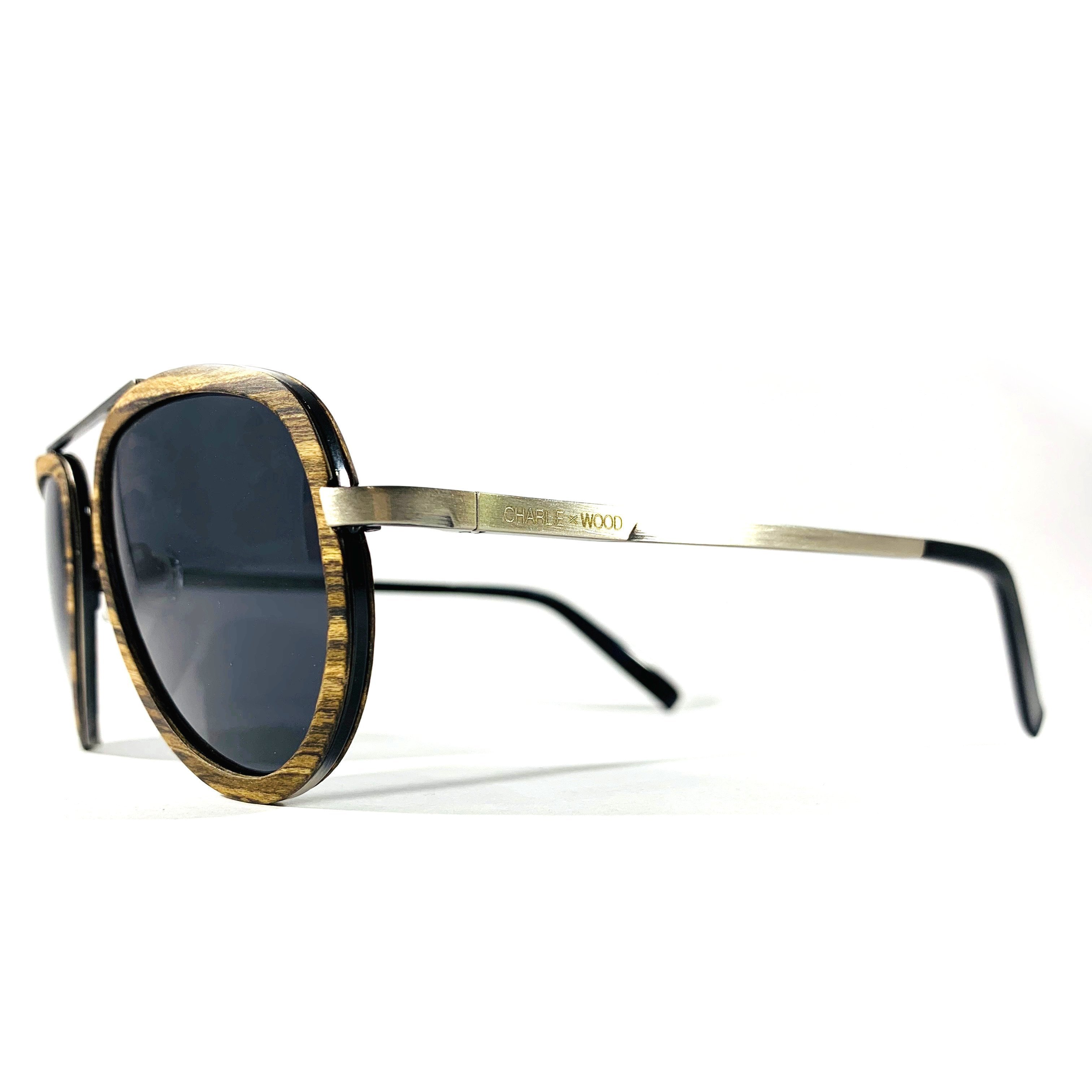 Sweet Auburn sunglasses featuring a brown oak wood frame and grey polarized lenses, stylishly designed for adults.