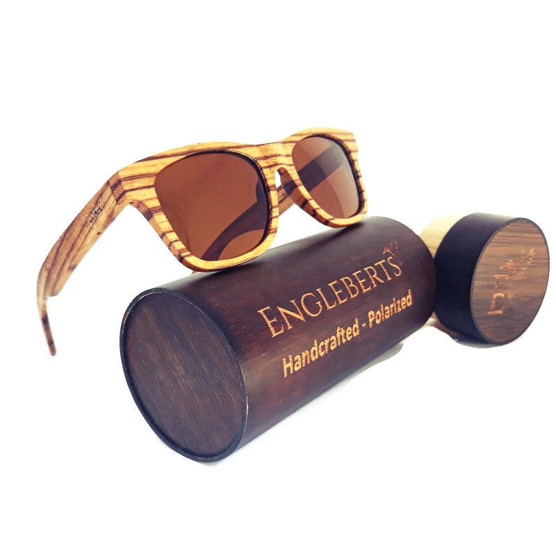 Engleberts Zebrawood Full Frame Polarized Sunglasses displayed with a bamboo case, showcasing their unique wood grain and stylish design.