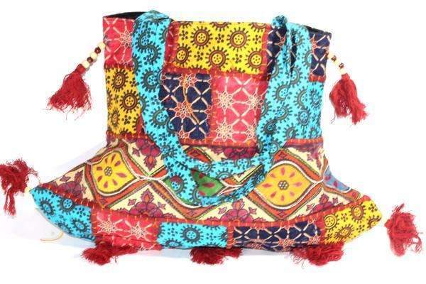 Festival Fireworks Jhola Tote Bag featuring colorful patchwork patterns, tassels, and a zipper enclosure, perfect for casual outings and everyday use.