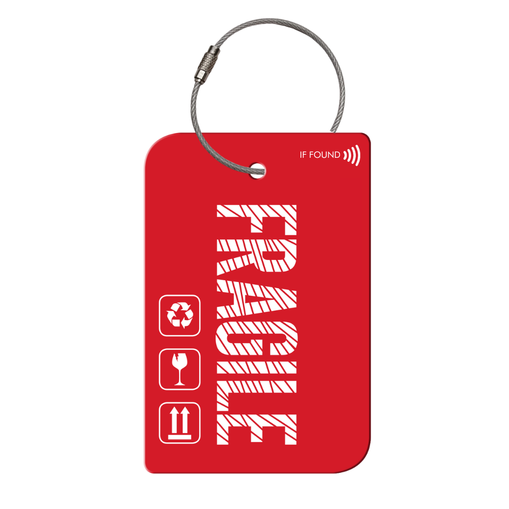 Retreev SMART Tag attached to a stylish travel bag, showcasing its durable stainless steel design.