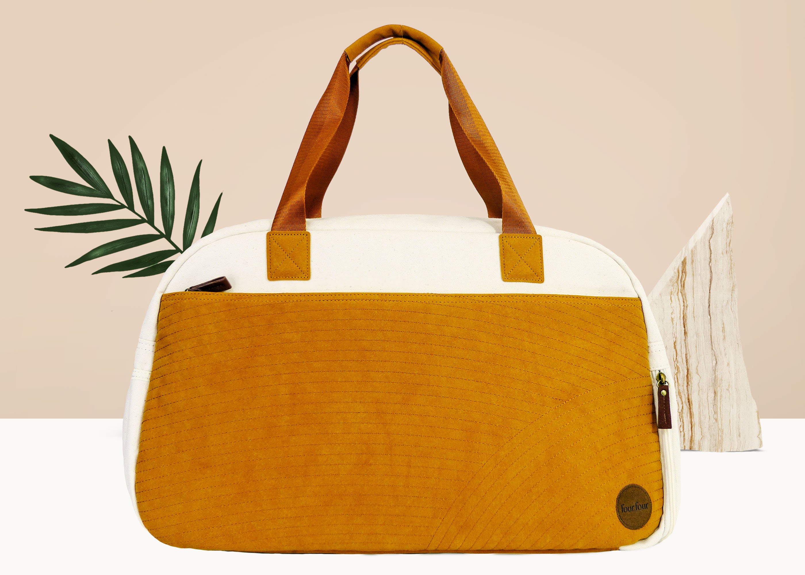 Getaway Duffel Bag in Bliss Curry and Cream color, showcasing its stylish design and spacious compartments for travel.