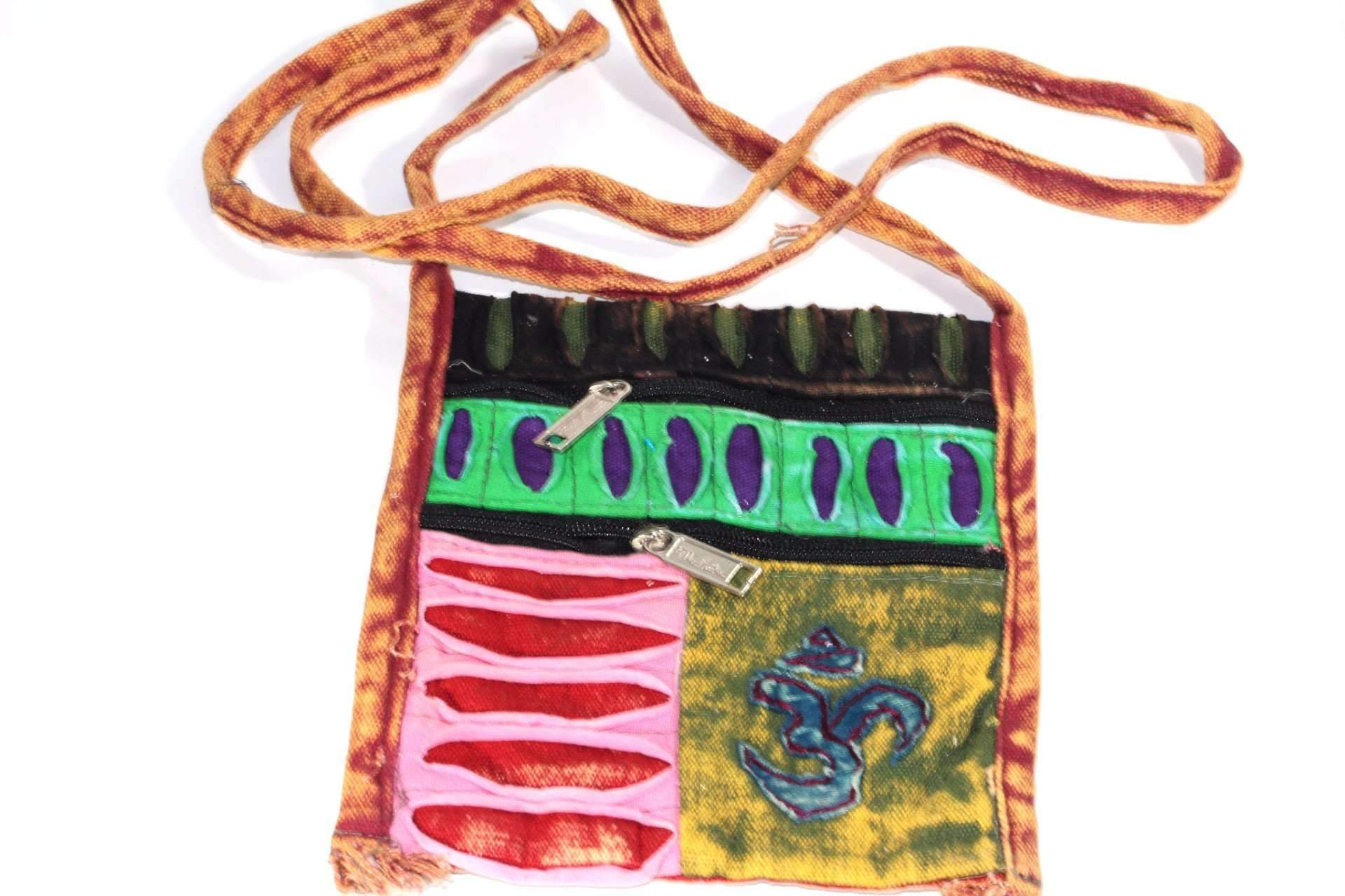 A colorful OM Cross Body Patchwork Jhola Bag featuring vibrant hippie patterns, made from 100% cotton with a secure zipper closure.