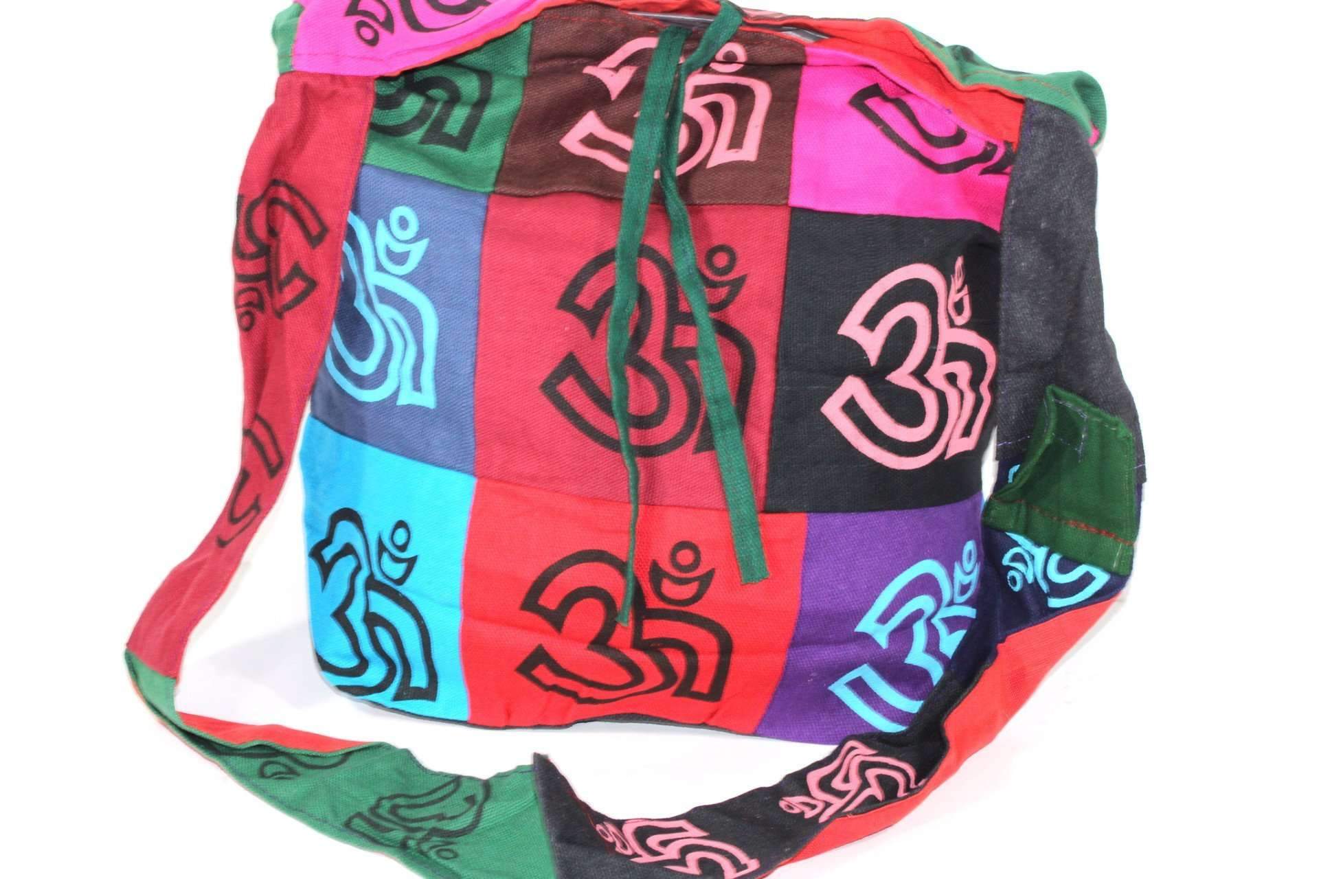 Colorful handmade Pop Art Om Patchwork Jhola Sling Bag made from 100% cotton, featuring a vibrant Om symbol design and drawstring closure.