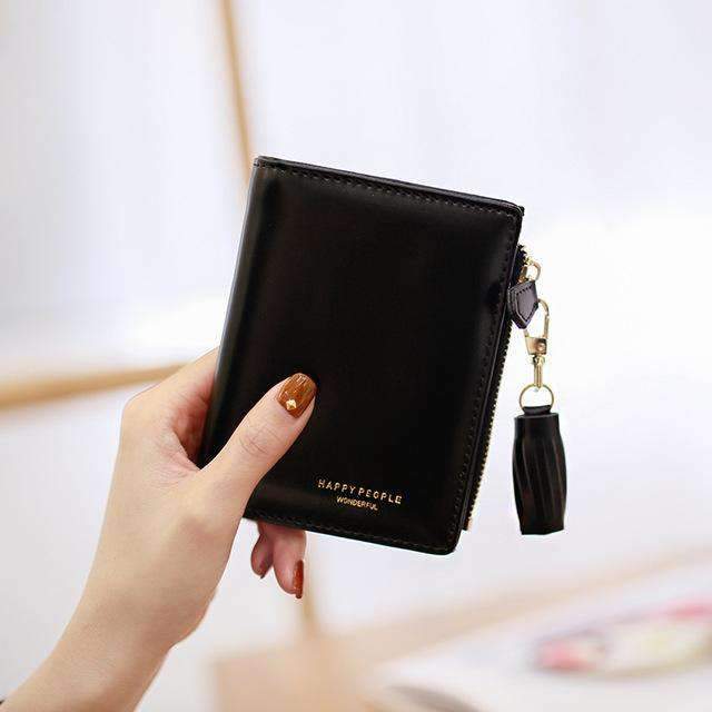 AMZER Bifold Tassel Women PU Leather Wallet in black, showcasing its sleek design and multiple card holder compartments.