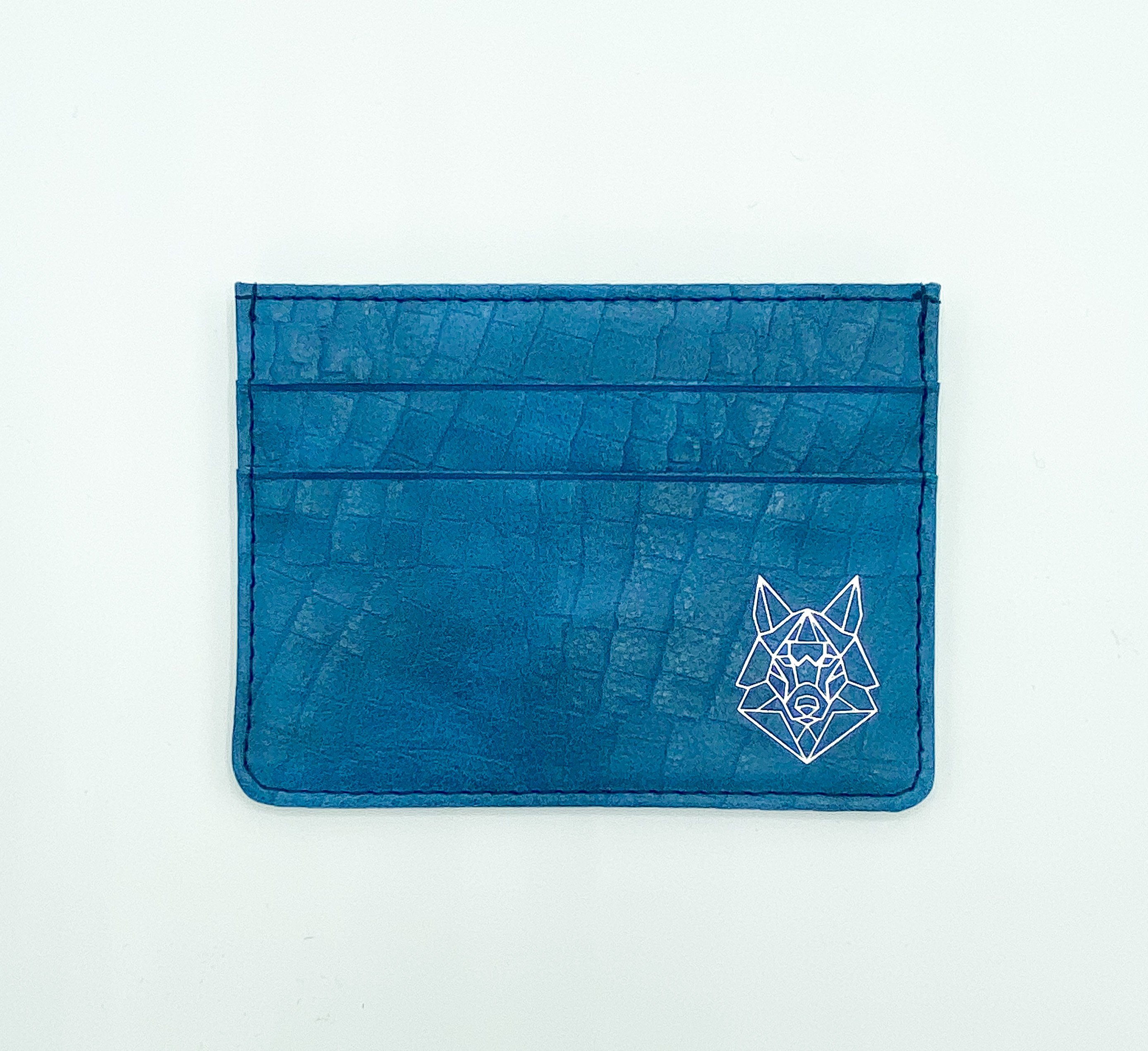 Crocodile Blue Card Case made of soft blue PU leather with silver foil logo, featuring five card slots and a sleek design.