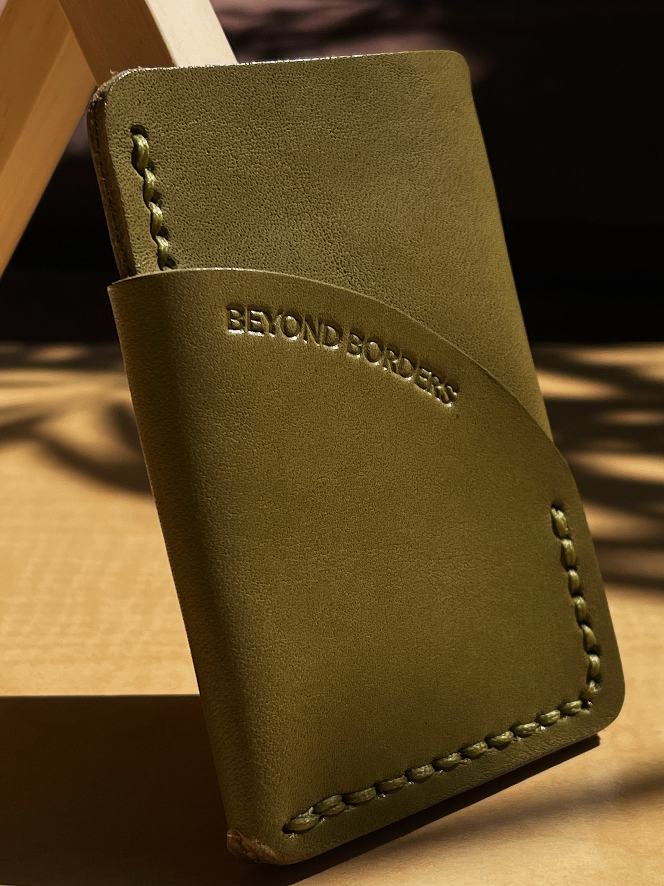 A handcrafted full-grain leather wrap wallet with three pockets, showcasing its elegant design and natural texture.