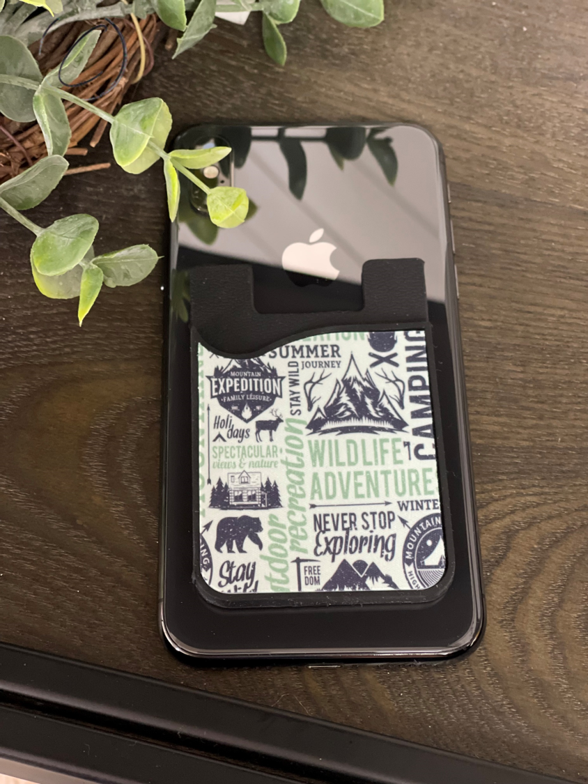 Outdoor Adventures Card Caddy Phone Wallet with microfiber screen cleaner attached, showcasing its sleek design and functionality.