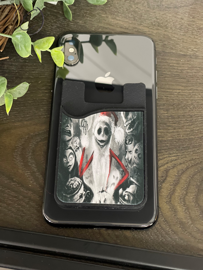 Sandy Claws Card Caddy Phone Wallet with microfiber screen cleaner attached, showcasing its sleek design and functionality.