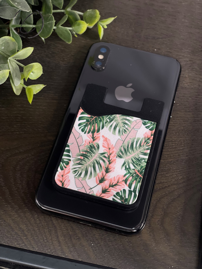 Tropical Blush Card Caddy Phone Wallet with microfiber screen cleaner attached, showcasing its stylish design and functionality.