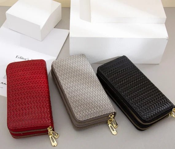 A stylish weaved designer wallet for women, showcasing multiple compartments and available in various colors.