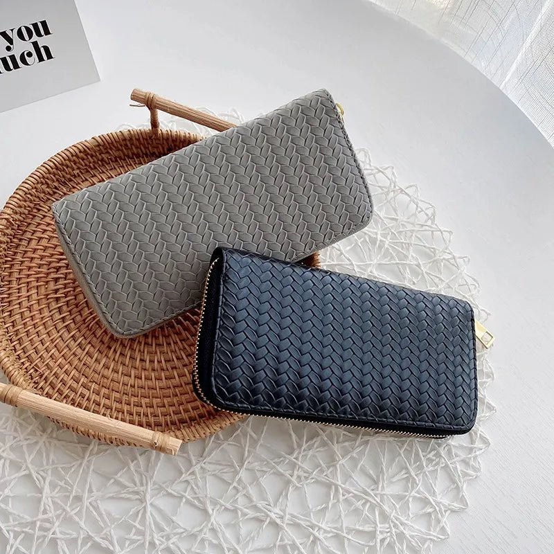 A stylish weaved designer wallet for women, showcasing multiple compartments and available in various colors.