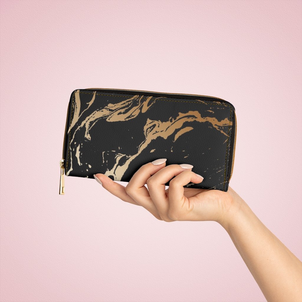 Stylish women's zip wallet in black and beige marble swirl design, showcasing its elegant faux leather finish and gold stitching.