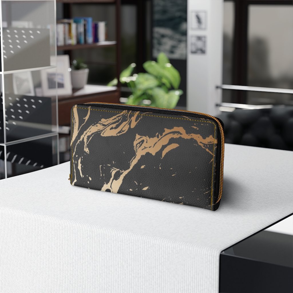 Stylish women's zip wallet in black and beige marble swirl design, showcasing its elegant faux leather finish and gold stitching.