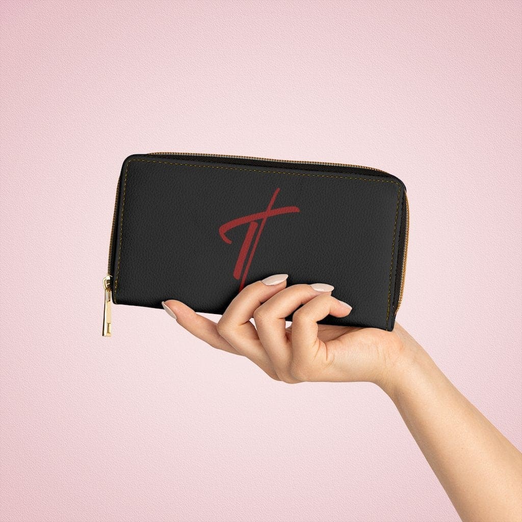 Stylish women's zip wallet in black and red with a cross design, showcasing its sleek faux leather finish and gold stitching.