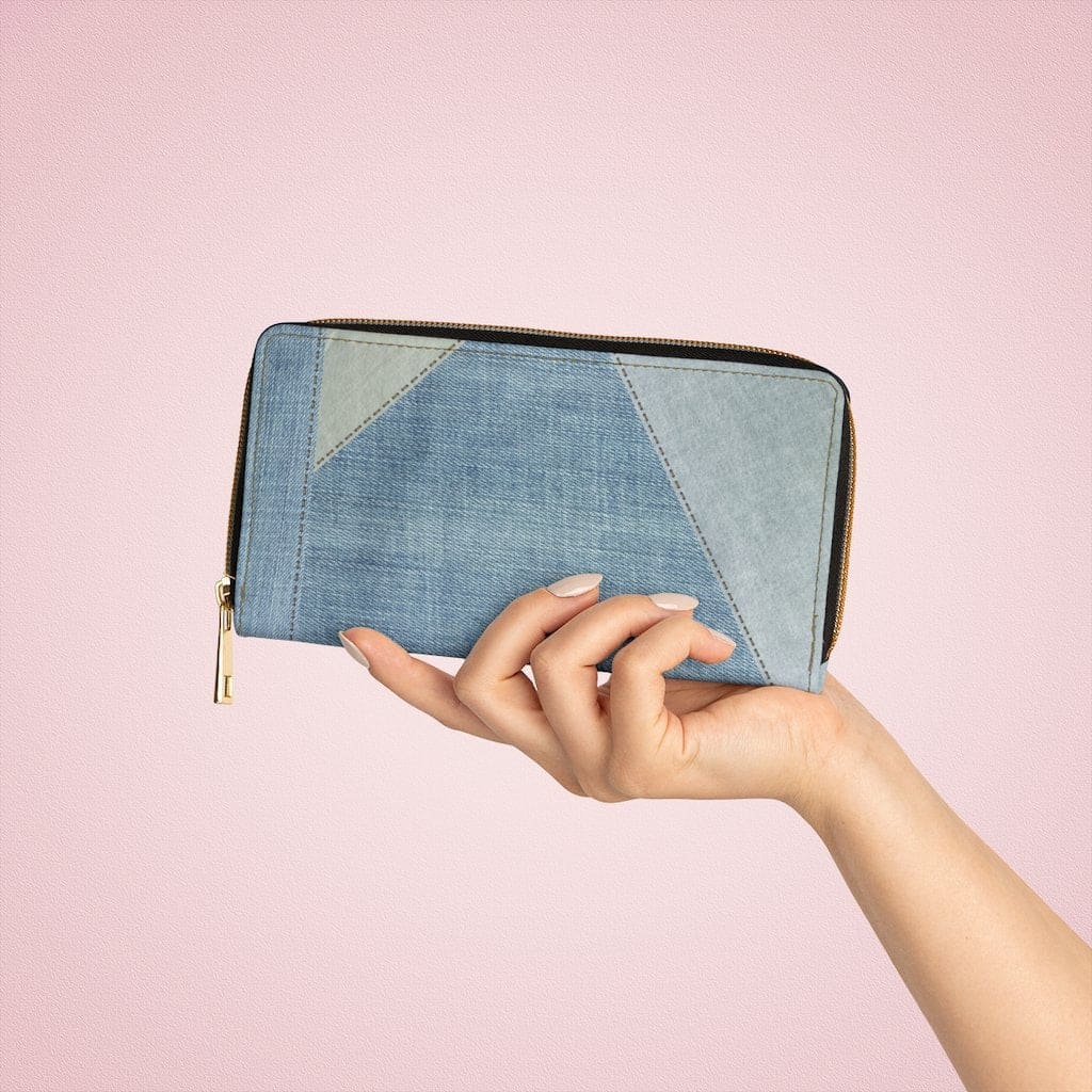 Stylish women's zip wallet in blue denim geometric design, featuring multiple pockets and a durable zip closure.