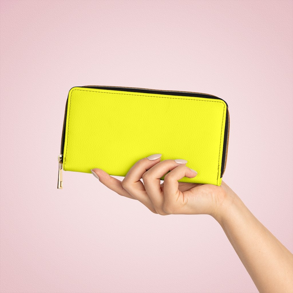 Bright yellow women's zip wallet made of faux leather with multiple pockets for cards and cash.