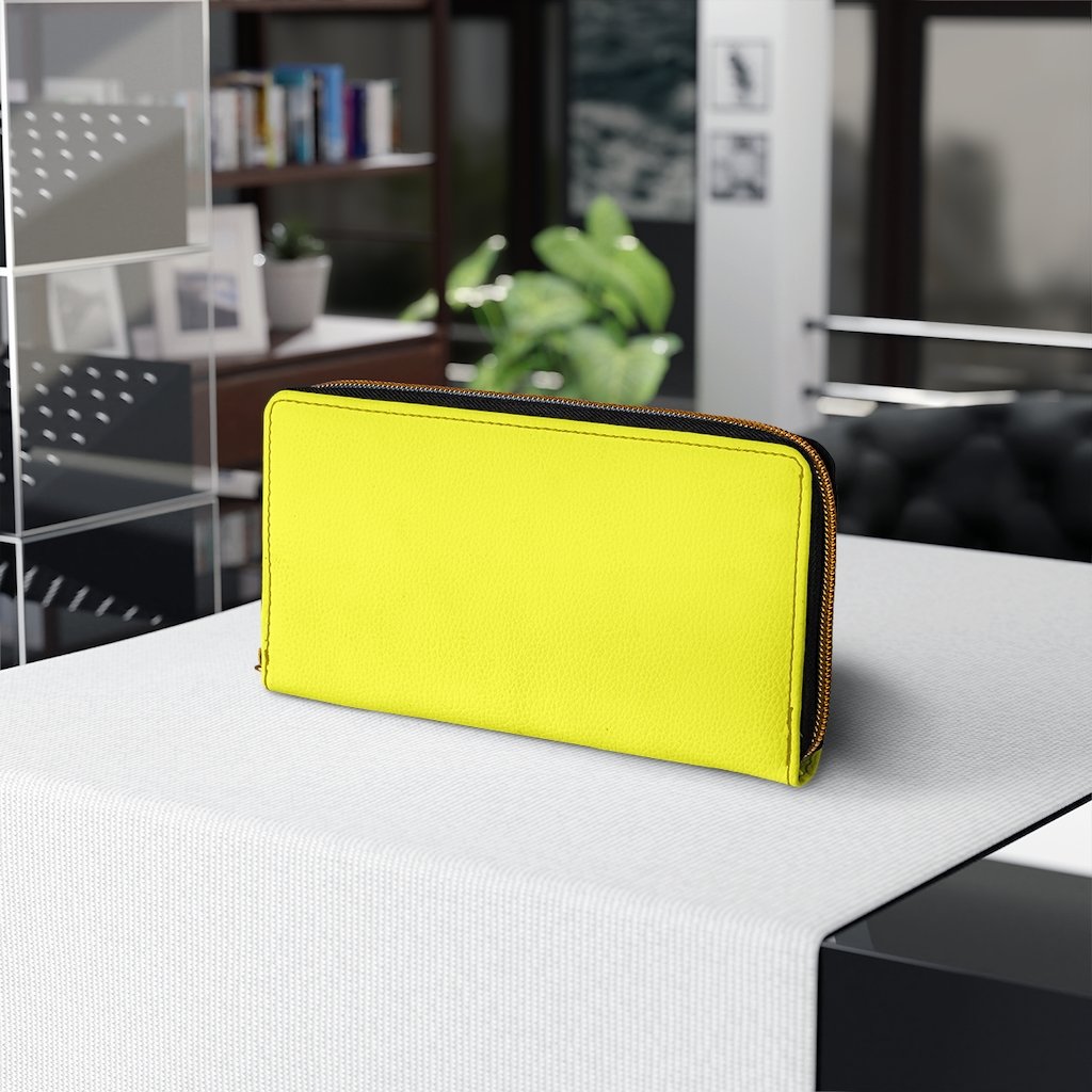 Bright yellow women's zip wallet made of faux leather with multiple pockets for cards and cash.