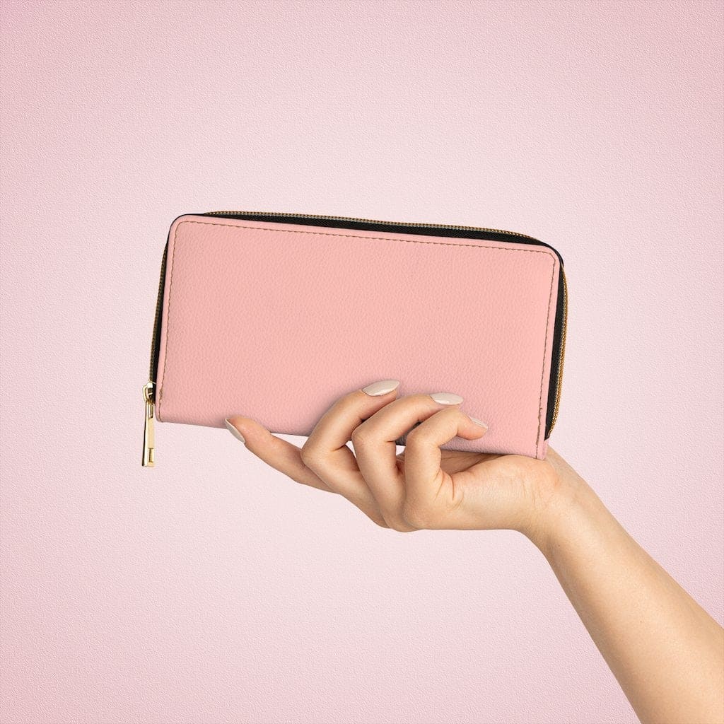 Pastel peach women's zip wallet made of faux leather with multiple pockets and gold stitching.