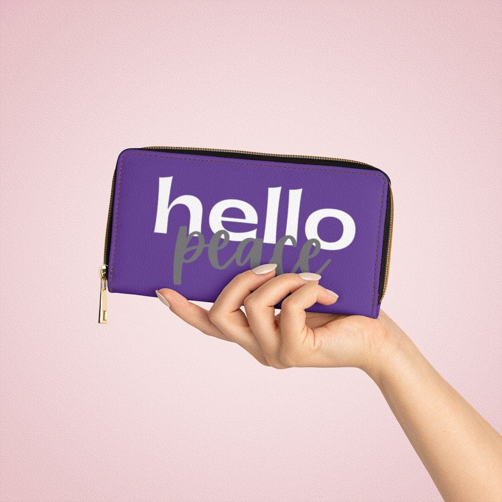 Purple and white zip wallet for women featuring 'Hello Peace' design, made from cruelty-free faux leather with gold stitching.