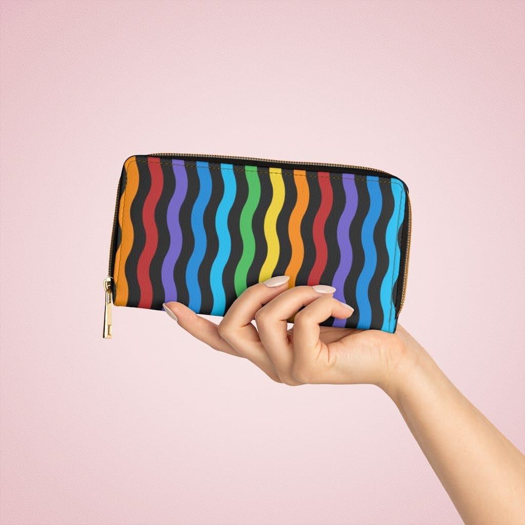 Colorful women's zip wallet featuring a rainbow swirl design, made from faux leather with multiple pockets.