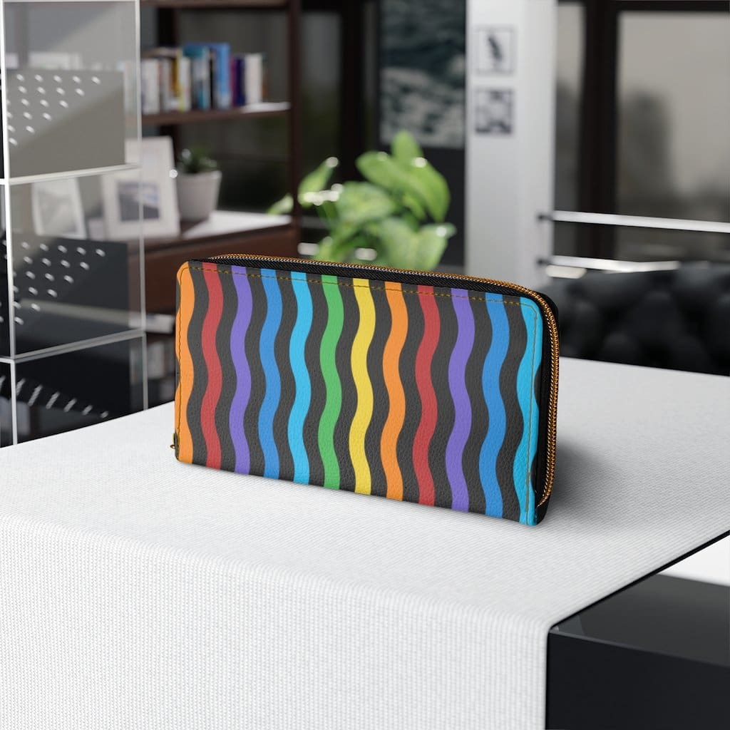 Colorful women's zip wallet featuring a rainbow swirl design, made from faux leather with multiple pockets.