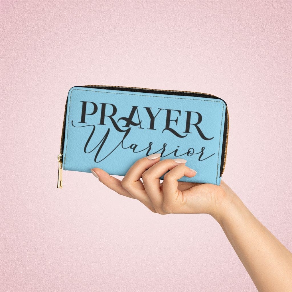 Sky blue and black zip wallet for women, featuring cruelty-free faux leather and gold stitching.