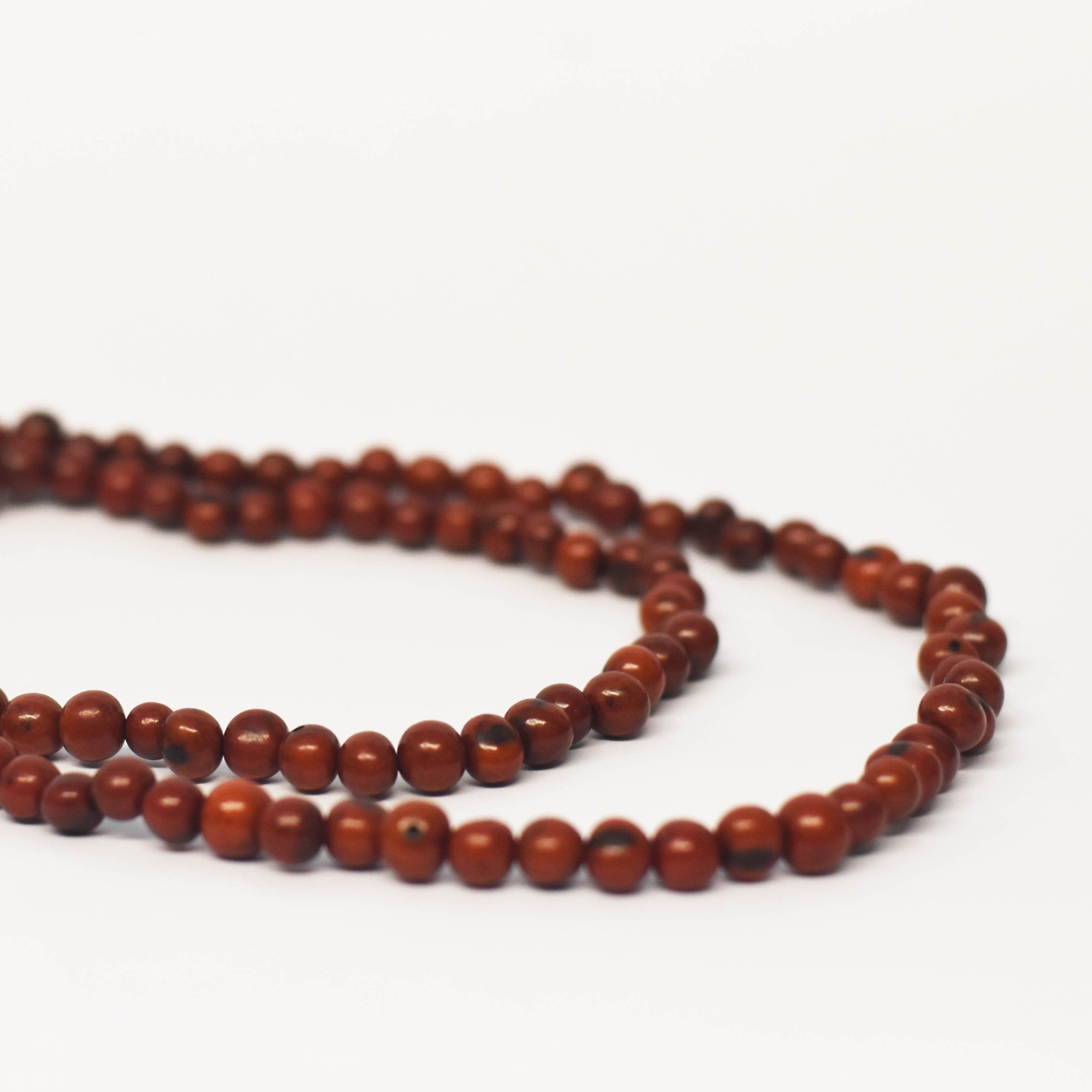 A beautiful Acai Strand necklace made from organic acai seeds, showcasing its versatile design and natural beauty.