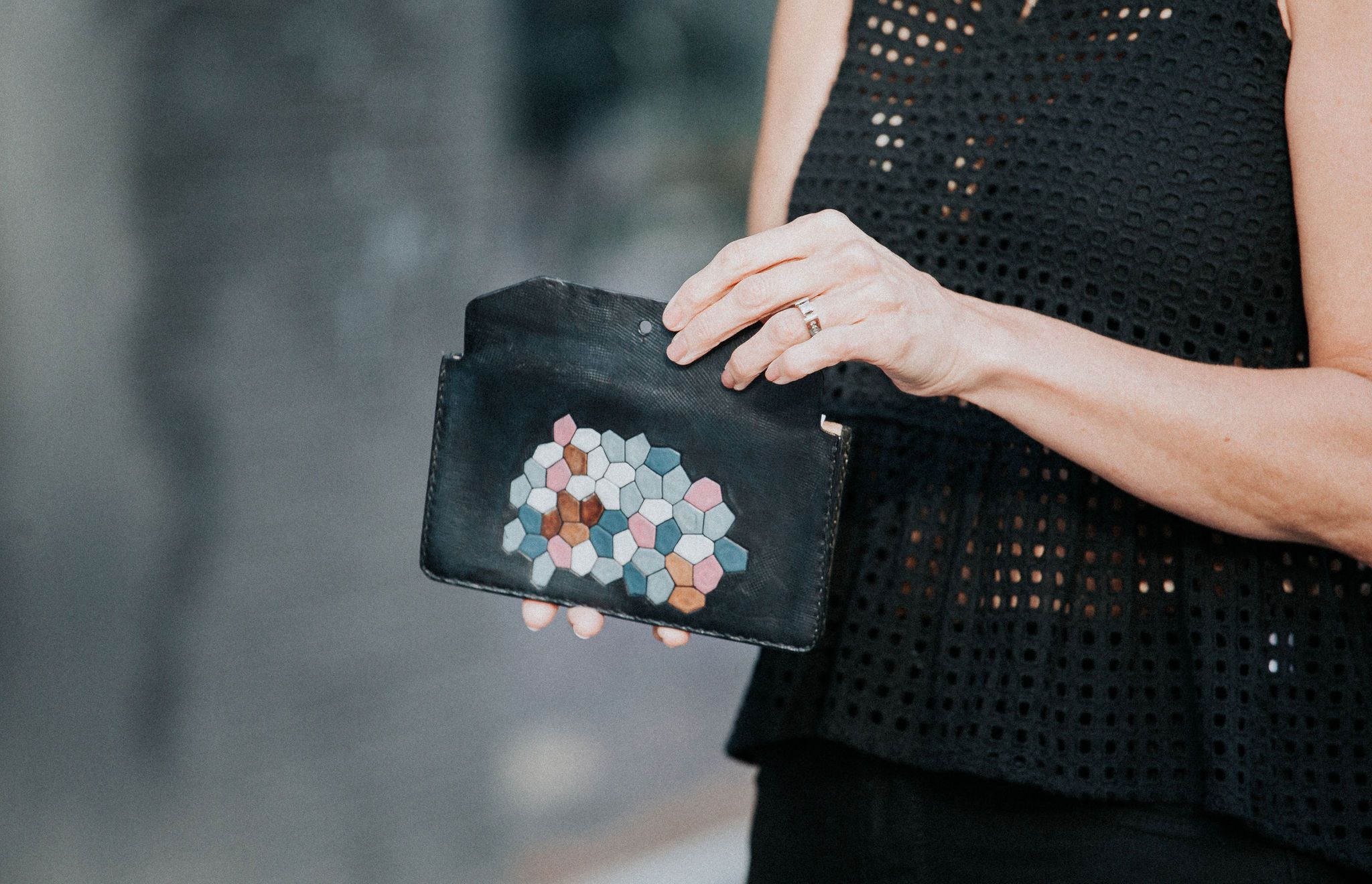 ACQUA Clutch made from vegtan leather with a water-inspired design, featuring five interior pockets.