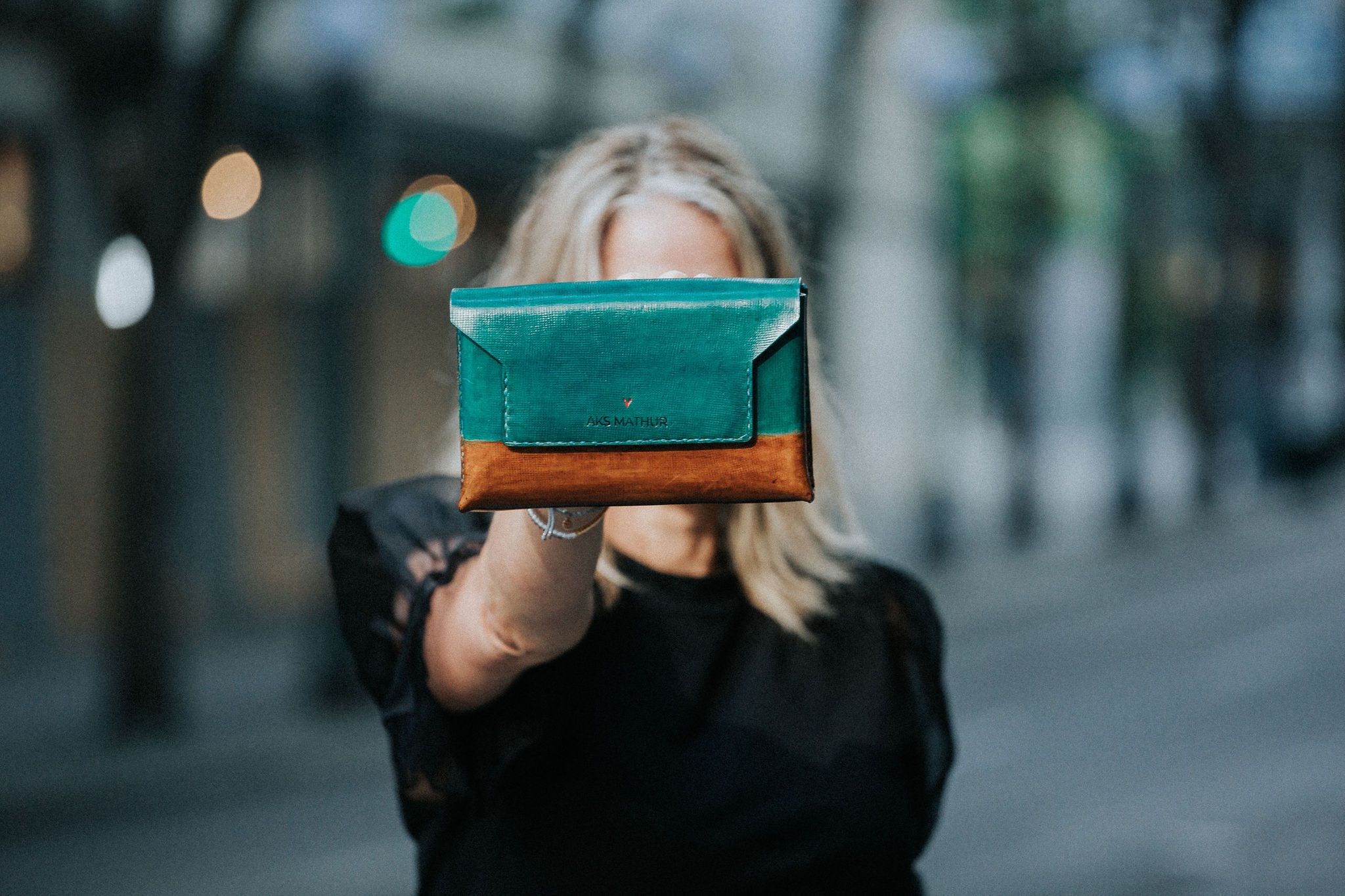 AER Belt-Bag in dual tone blue and sepia, crafted from natural vegetable tanned leather, showcasing its minimalist design and magnetic closure.