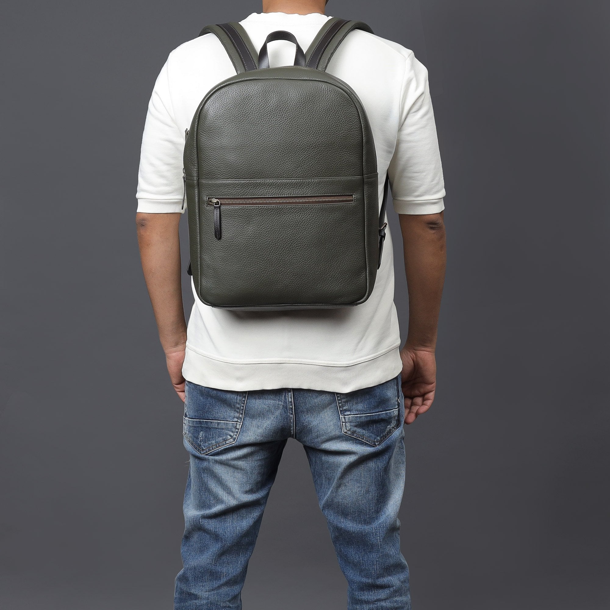 Alabama Leather Backpack made from premium full grain leather, featuring multiple pockets and a spacious laptop compartment, ideal for daily use.