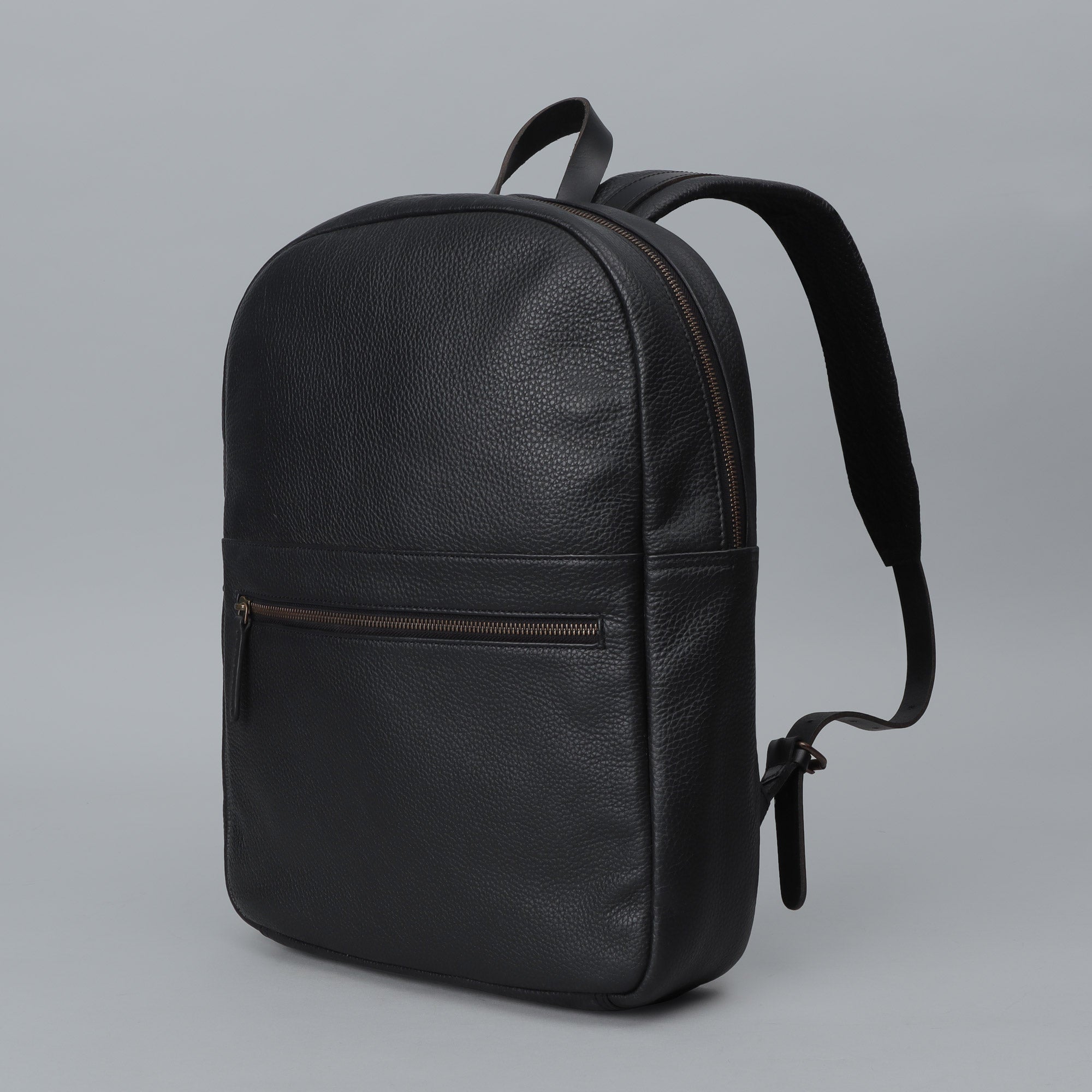 Alabama Leather Backpack made from premium full grain leather, featuring multiple pockets and a padded laptop compartment.