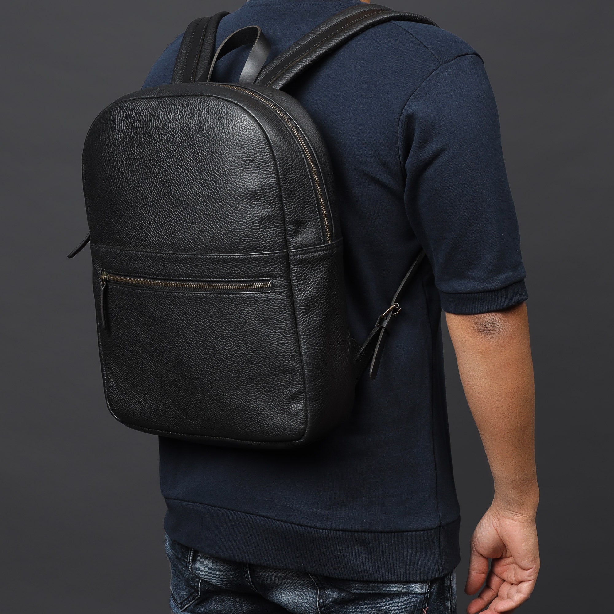 Alabama Leather Backpack made from premium full grain leather, featuring multiple pockets and a padded laptop compartment.