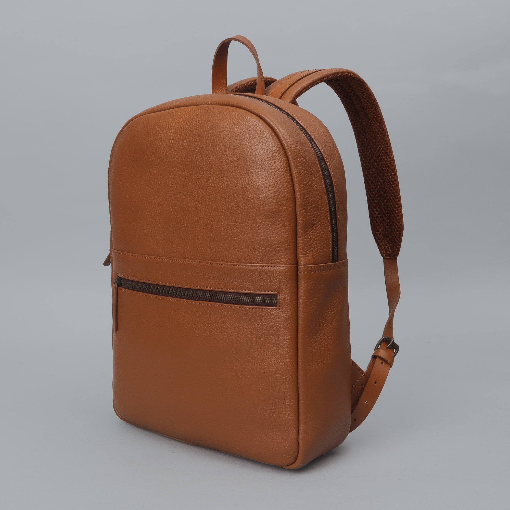 Alabama Leather Backpack made from premium full grain leather, featuring multiple pockets and adjustable padded straps, ideal for everyday use.